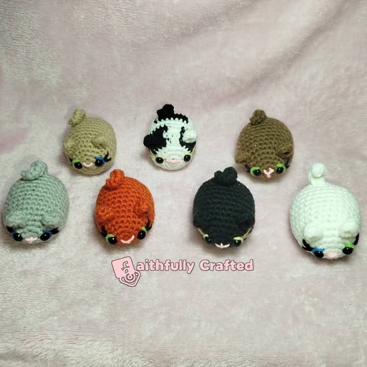'Happiness is a warm, chubby kitty.' — handmade crochet keychains by Faith